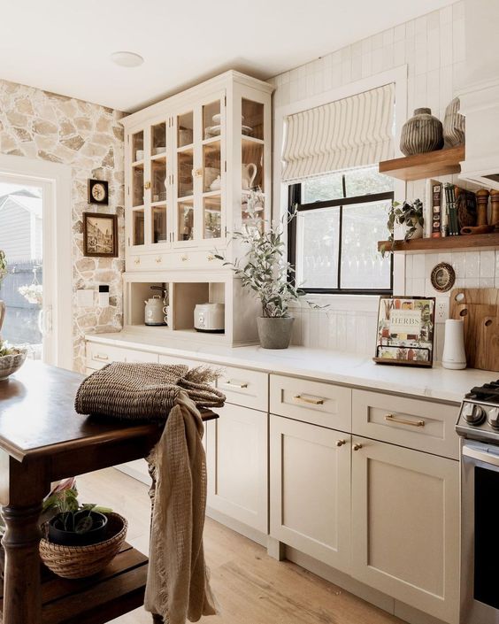 A linen tea towel with a subtle floral pattern draped over a wooden drying rack, adding a touch of cottagecore charm to the herb drying station.