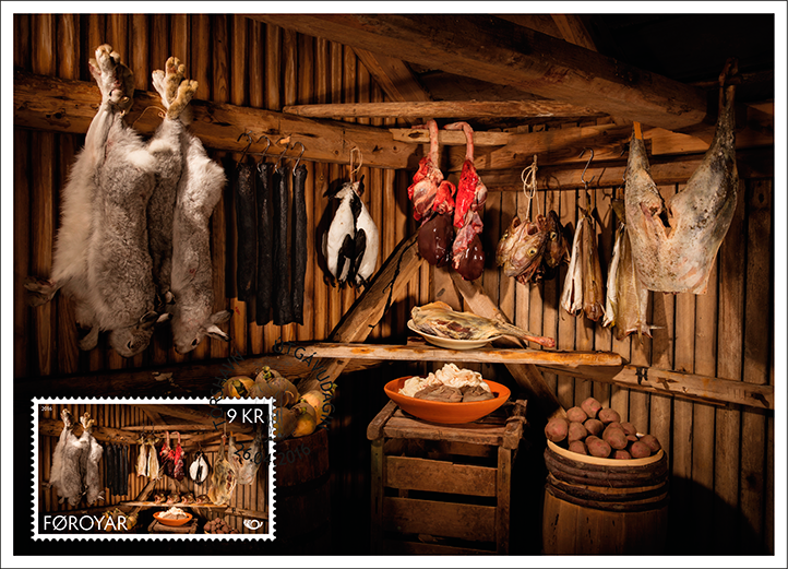 Kallur Lighthouse on Kalsoy, shrouded in fog and drizzle.