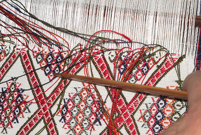 Bhutanese woman weaving Kushutara textiles