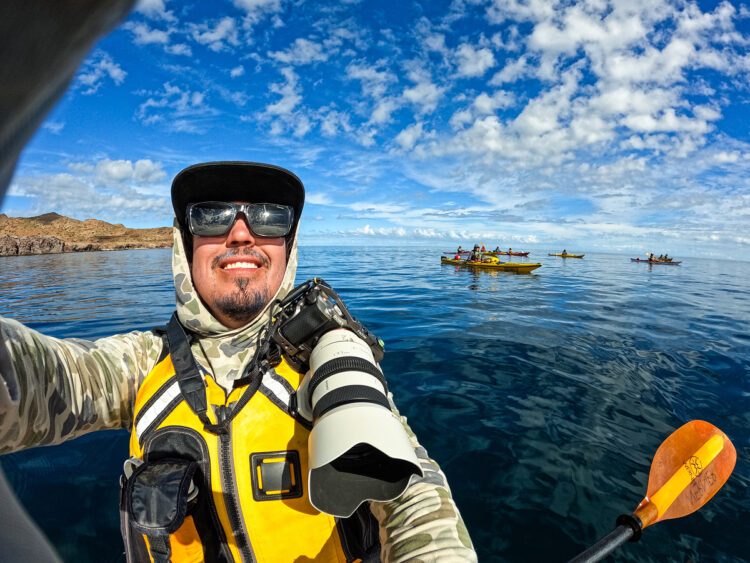 A person wearing Waterlust apparel, highlighting their dedication to donating profits to marine conservation organizations
