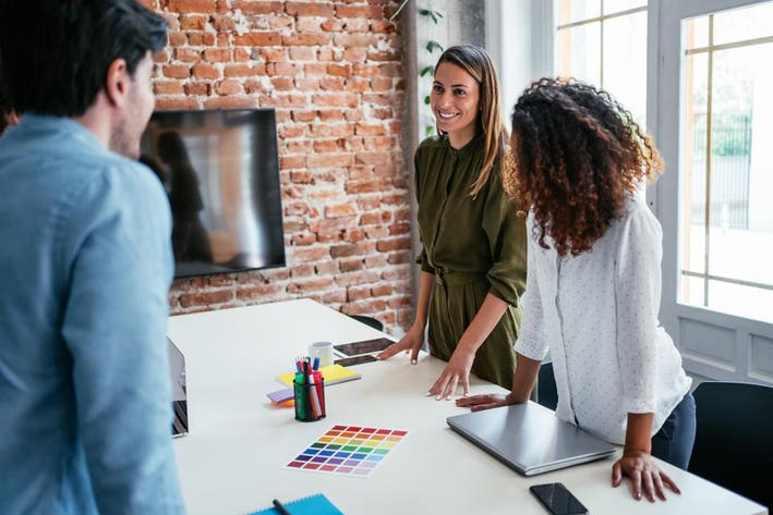 An image of a diverse group of game developers collaborating