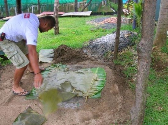Kai Aroha standing under a starry night sky in the Cook Islands, gazing upwards at the Milky Way, showing his connection with the cosmos.