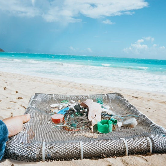 Volunteers collecting and sorting debris at Kamilo Beach