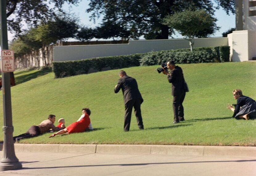 Frame 202 of the Zapruder film, with brightness and contrast adjusted to reveal details in shadows around the Umbrella Man.