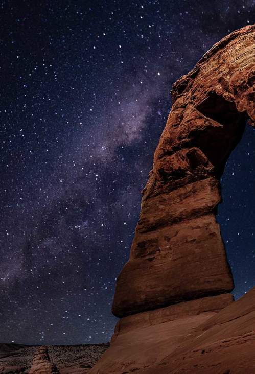 A vibrant sunrise illuminates the hoodoos of Bryce Canyon, showcasing the fiery colors and whimsical landscape.