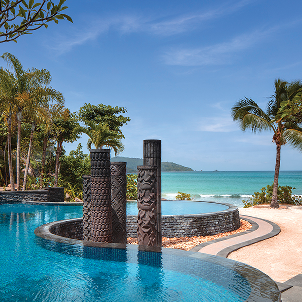 Anantara Maia Seychelles Villas showing a private villa with a plunge pool overlooking a stunning beach and ocean. Alt text: Anantara Maia Seychelles luxury eco-tourism private villas
