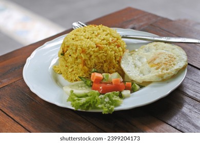 Hands of an Orang Asli artisan demonstrating bamboo weaving techniques in a workshop at Lake Kenyir