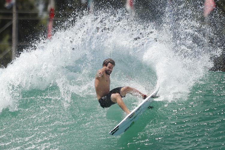 Sipho riding a wave at Muizenberg Beach