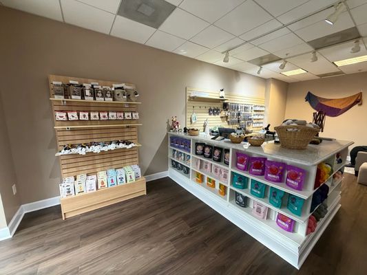 A visually appealing flat lay of CraftedKind soaps with natural ingredients like shea butter and essential oils surrounding them