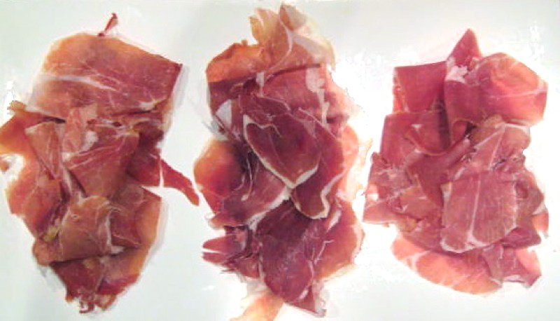 Hands kneading dough, bathed in warm, natural light streaming through a window.
