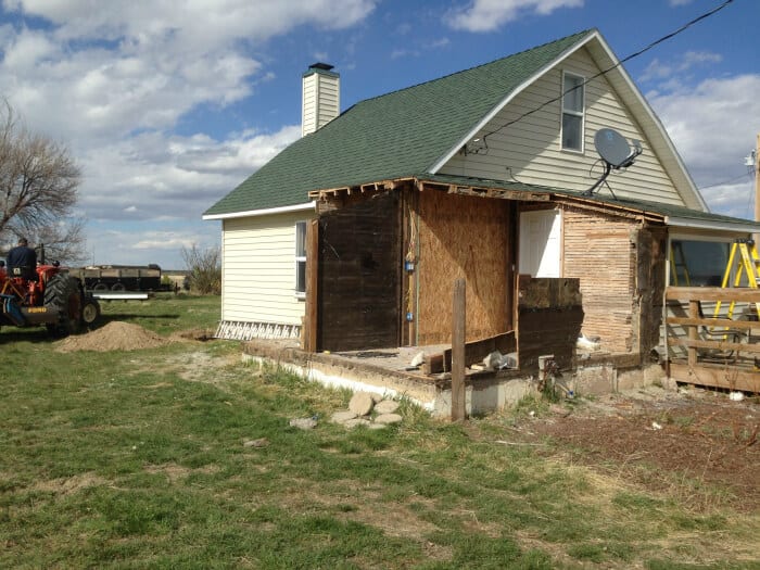 Exterior image of farm house that has reclaimed wood siding